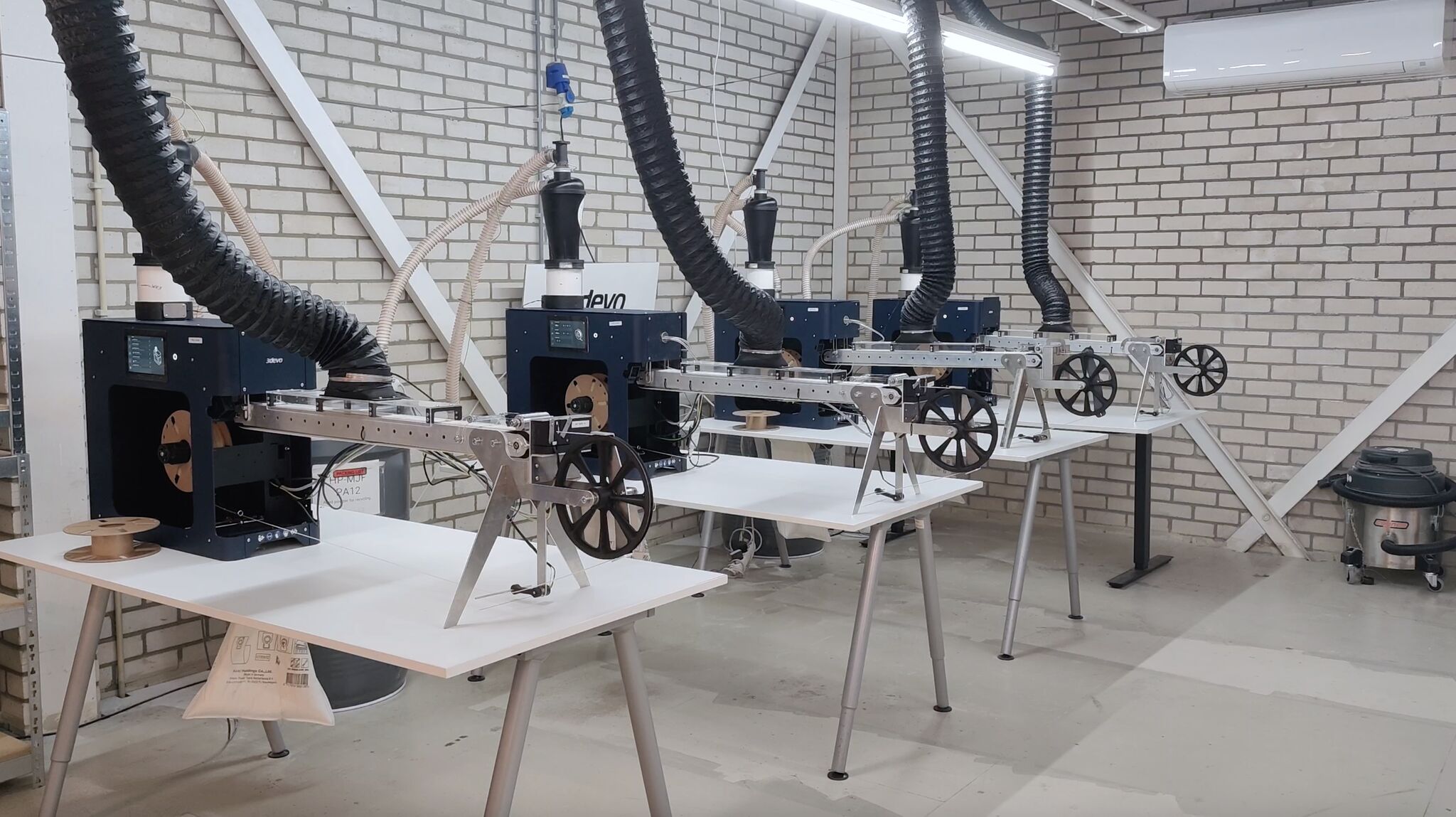 Four filament maker TWOs continuously recyling PA12 powder waste into filament.