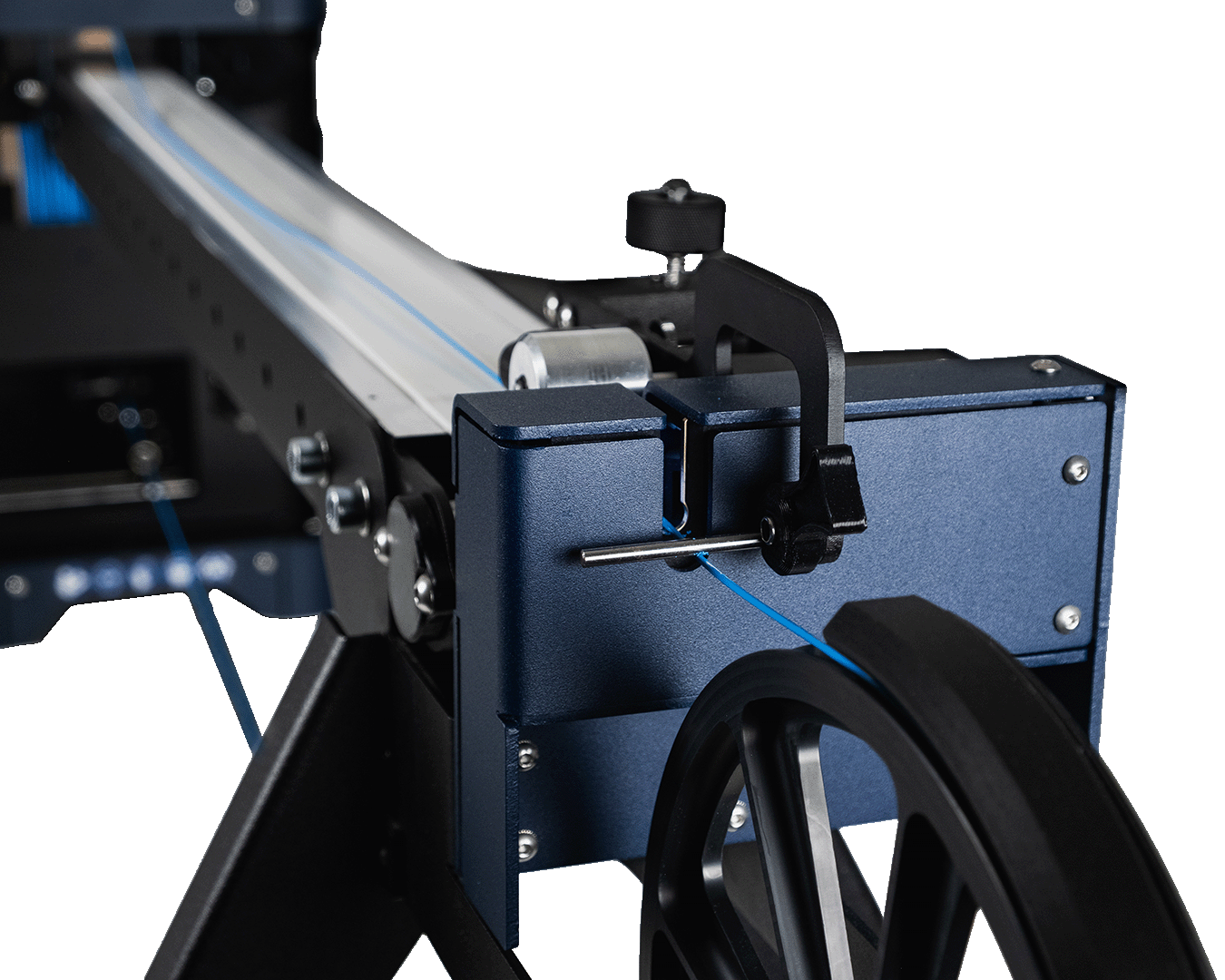 Close-up of the FMX10 conveyor's 3-axis filament sensor and guide pulley near the winder, with blue filament threading through toward the winder.