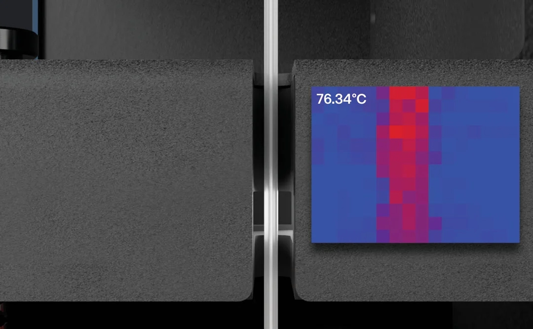 Infrared thermal camera view inside the Filament Maker X10 showing the filament surface at 76.34 °C before spooling