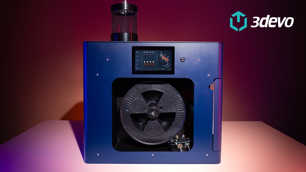 The Filament Maker TWO with a deep red background.
