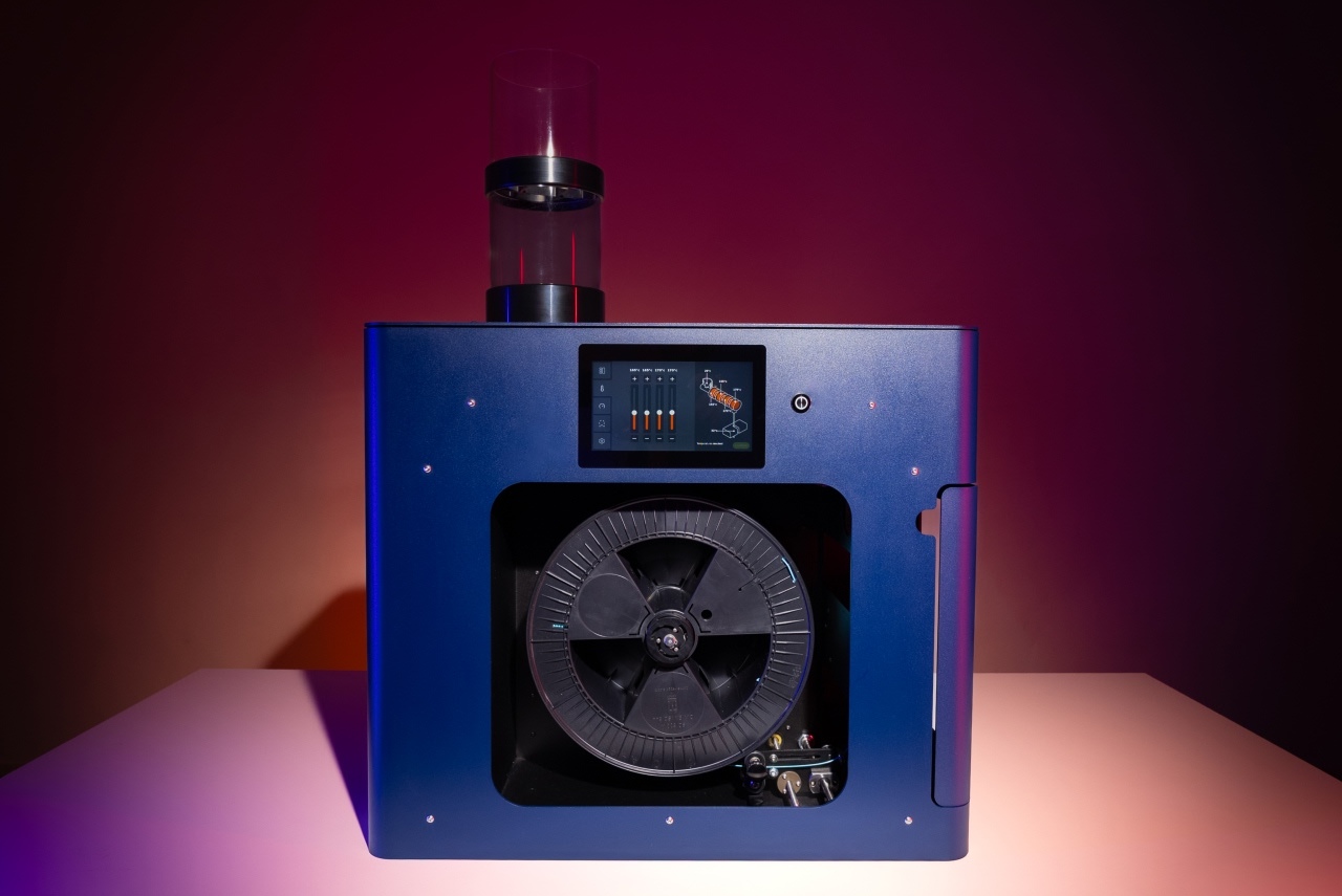 The profile of the filament maker two, on a dark red background