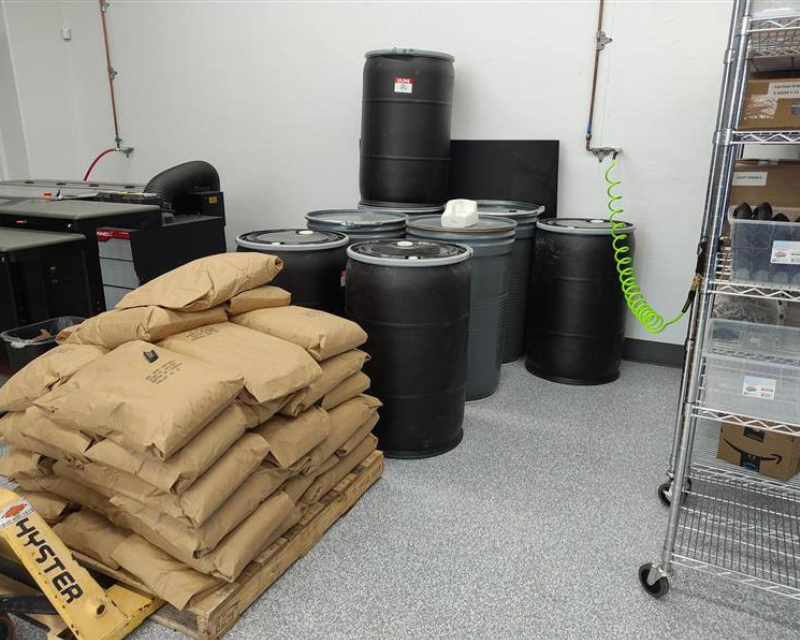 Bags of SLS powder stacked on top of each other.
