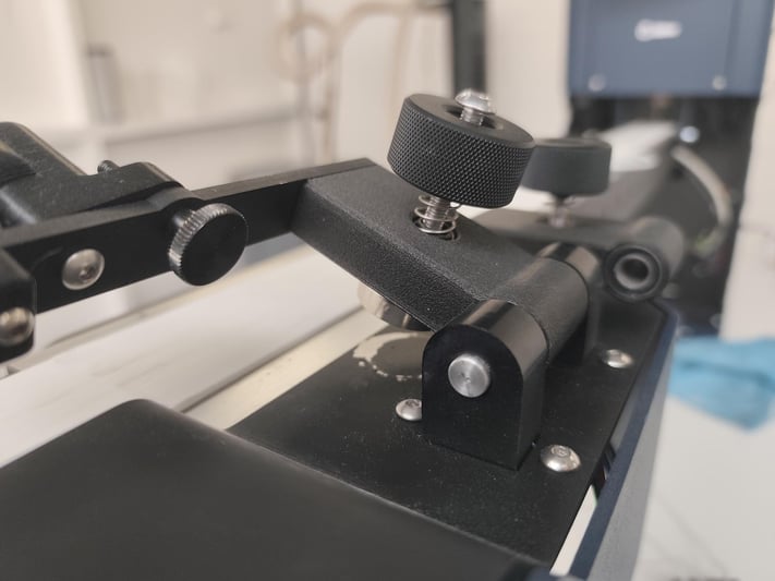 3D-printed filament stabilizer bracket on the Filament Maker X10 cooling path, printed with rPA12 + 10% rCF.