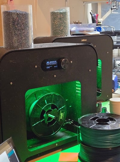 Two Filament Makers, with their hoppers filled with shredded plastic waste