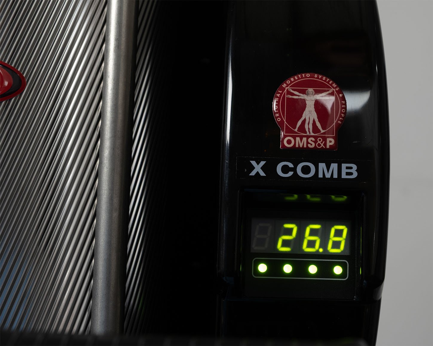 Close-up of the XD12 desiccant dryer's front display and LED status indicators on the X COMB control unit.