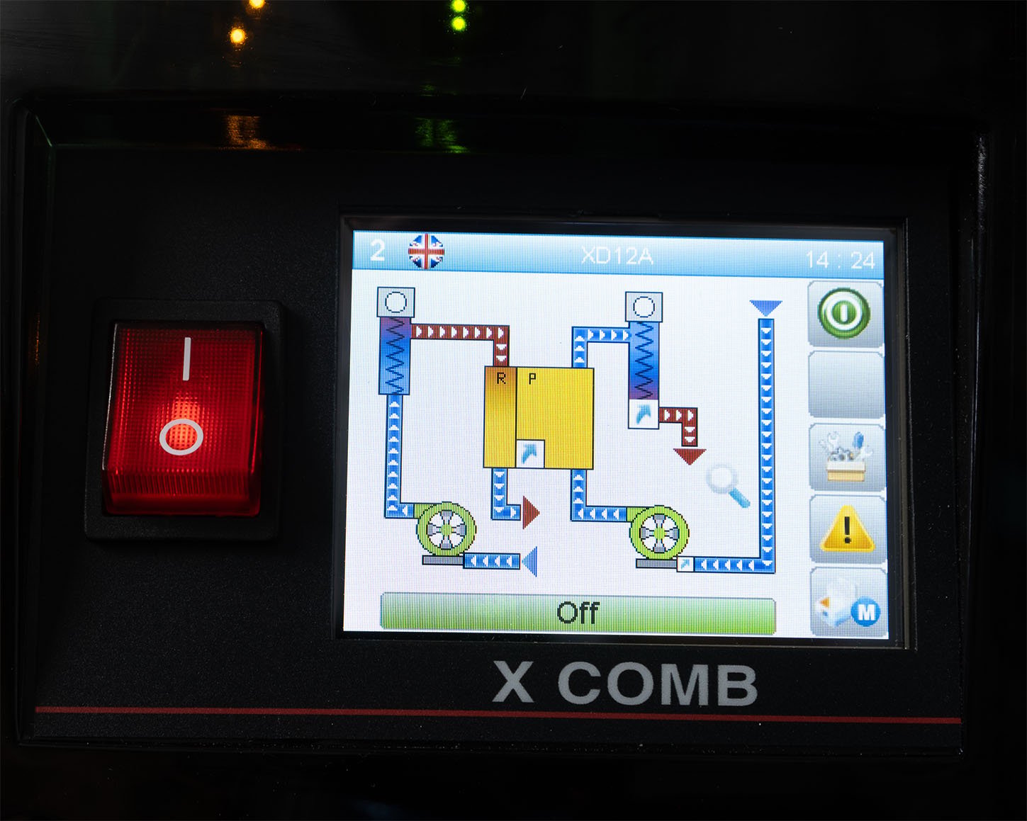 The XD12 desiccant dryer's color touchscreen showing the live process mimic of the drying and regeneration circuits, with the XD12A model identifier in the header.