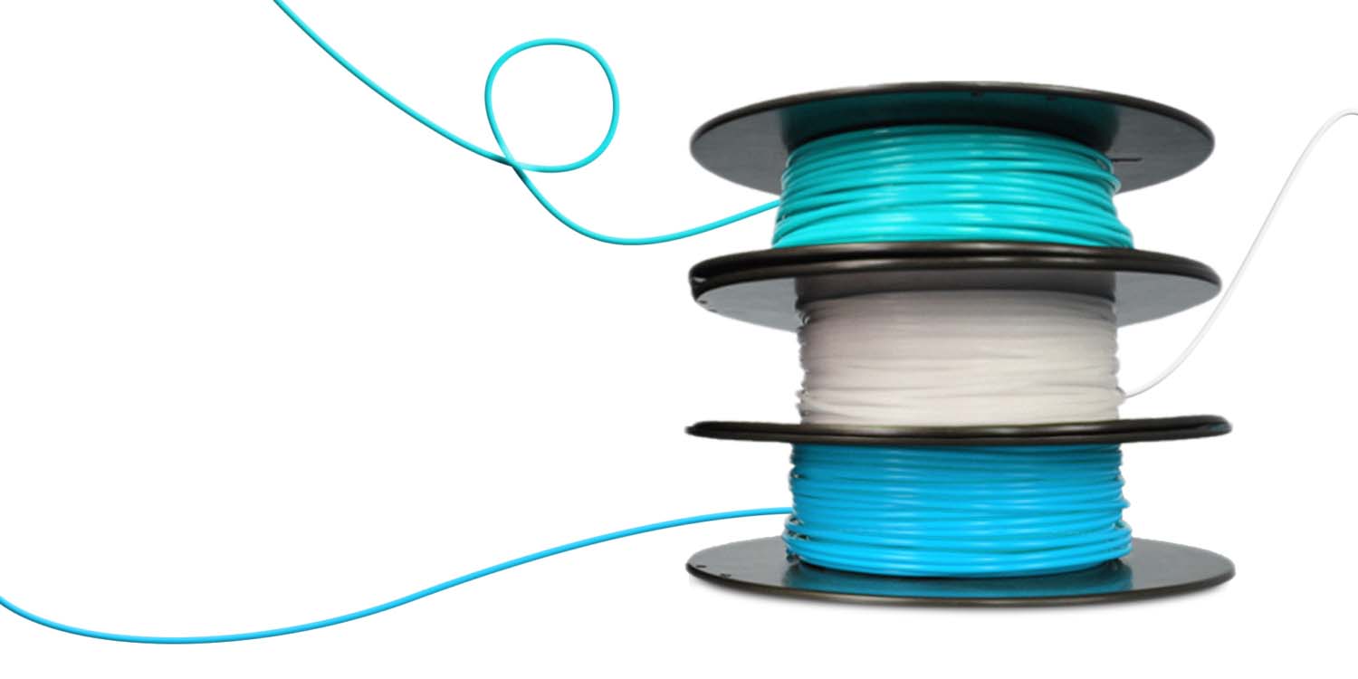 3 spools of different blue filaments stacked on top of each other.
